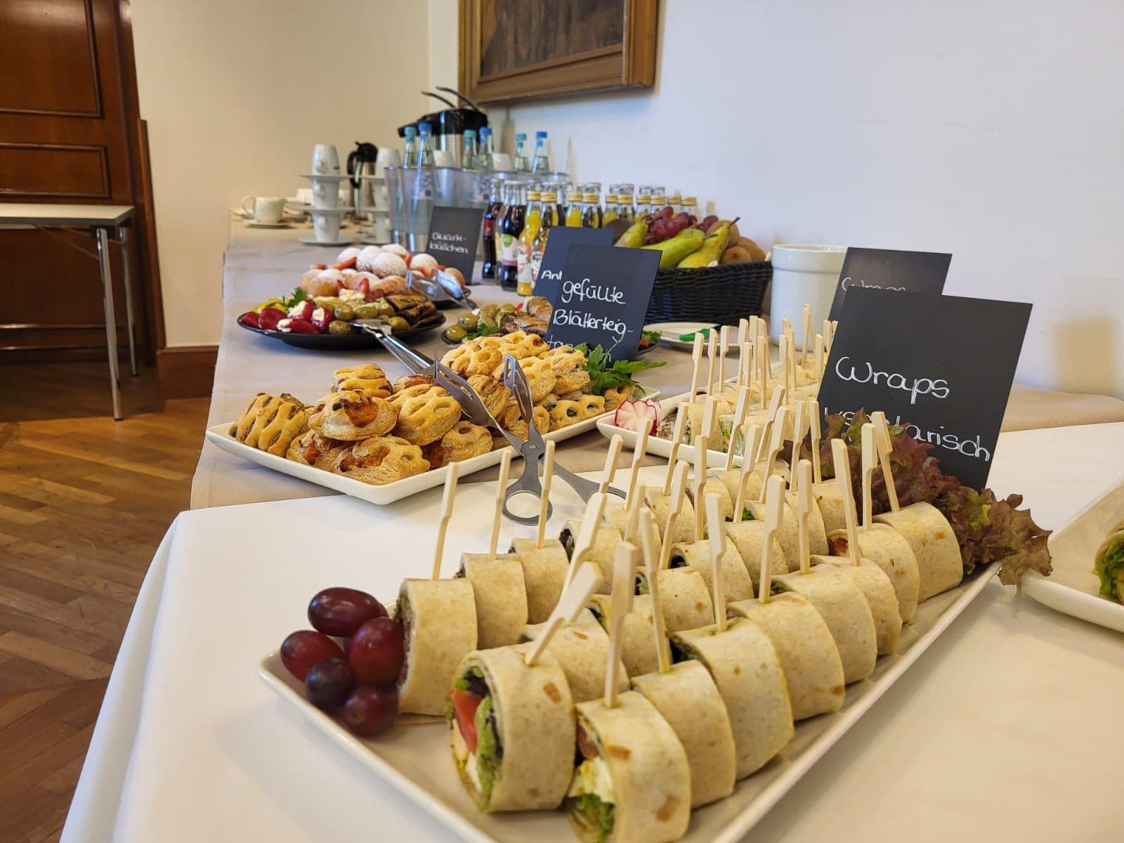 Refreshments for a conference break: sandwiches, fruit and pastries