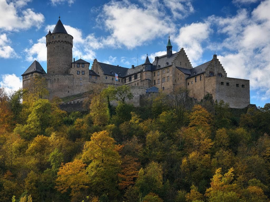 Castle complex on a wooded hill